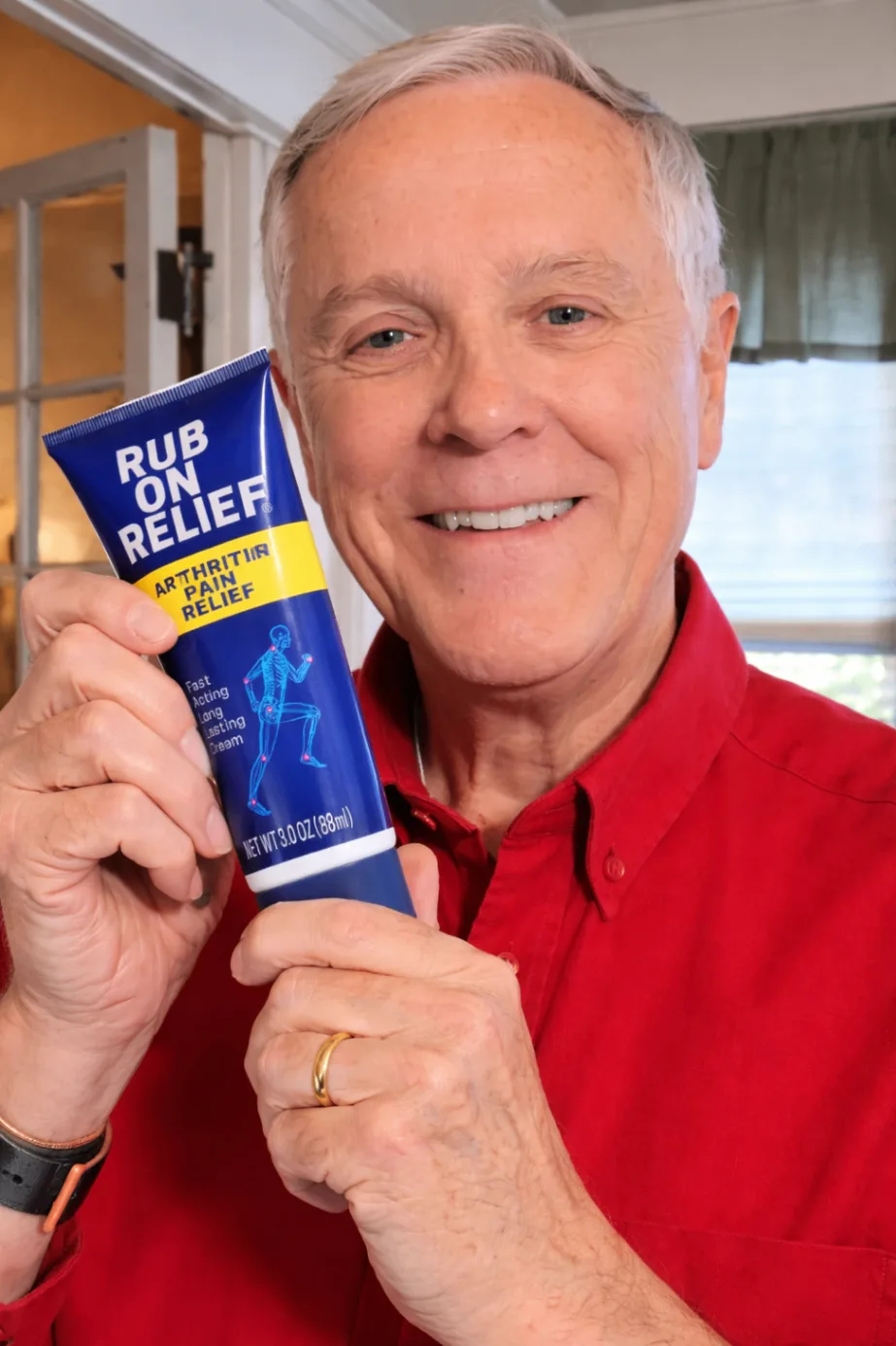 Customer smiling while holding Rub On Relief